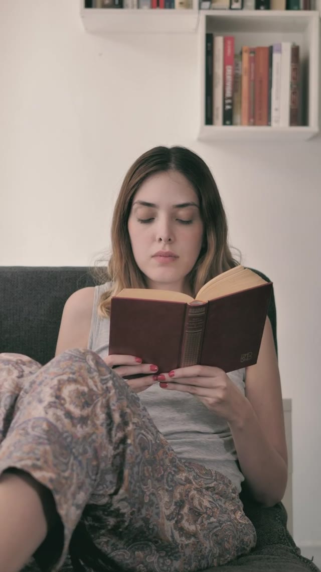 Reading Book on Couch