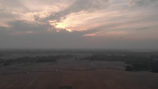 Aerial Sunset Over Farmland